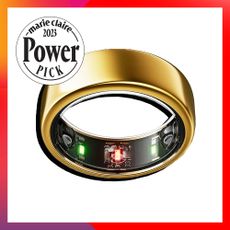 A gold ring with black and green lights and circuitry within the band