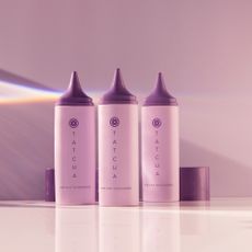 three creams presented in purple bottles